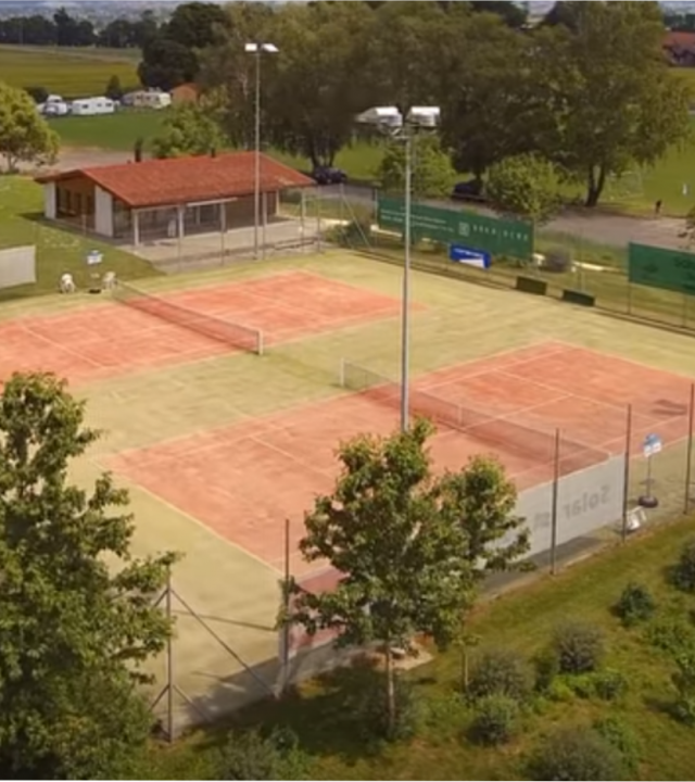 Aerial view of Tennis Club Ins' two clay courts